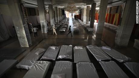 A banquet hall that is normally used for weddings has been converted to makeshift coronavirus hospital as the Indian capital struggles to contain a spike in cases.  