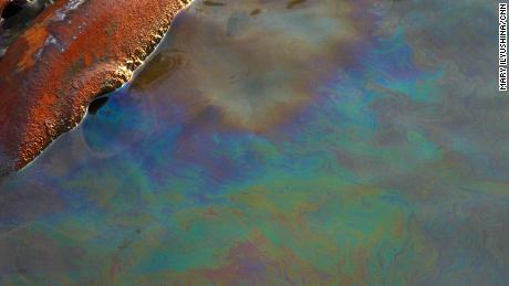 A layer of gasoline visible on the  surface of the Daldykan River.