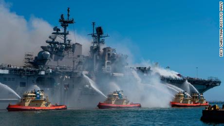 Sailors and federal firefighters combat a fire onboard the amphibious assault ship USS Bonhomme Richard at Naval Base San Diego onJuly 12.