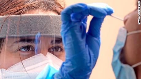 Another day of record coronavirus cases as more states rethink mask mandate