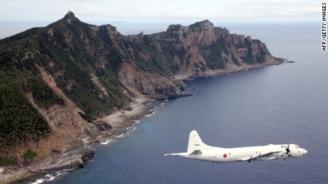 A Japan Self-Defense Force planes flies over the Senkaku Islands in this file photo.