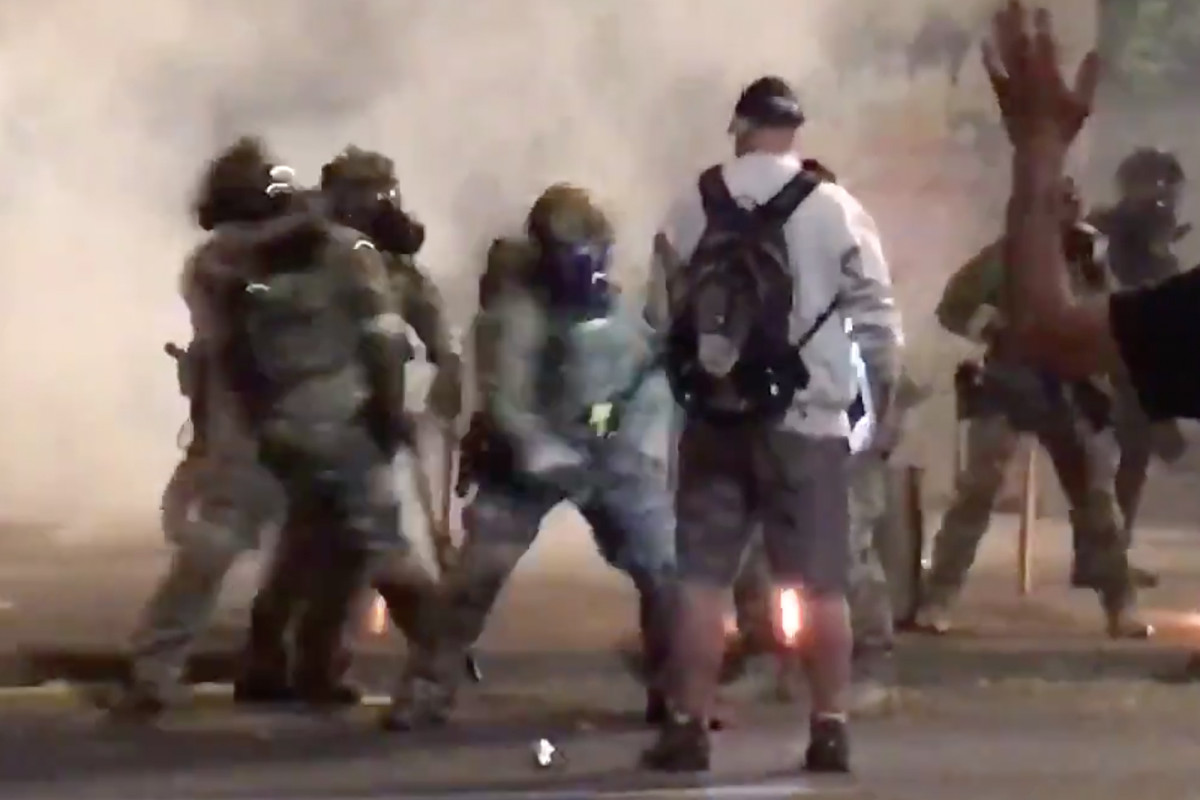 Protester appears unfazed by baton beating, pepper spray in wild video