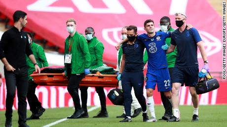 Pulisic was helped off injured at the start of the second half.