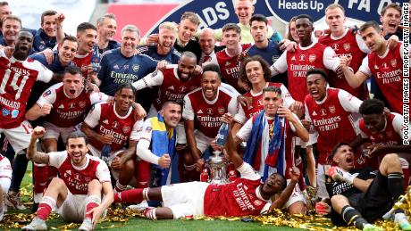 Arsenal players celebrate winning the FA Cup final.