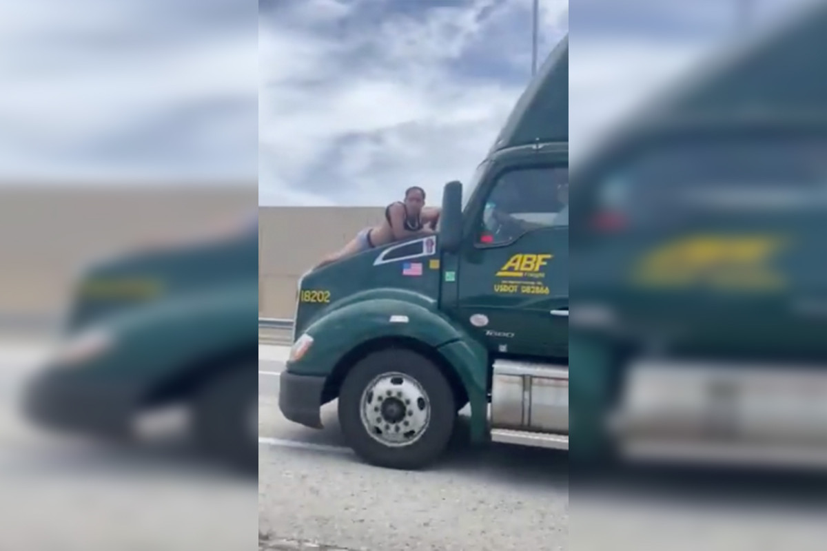 Wild video shows Florida man on hood of moving semitruck