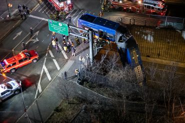 Crashed through barriers: New York bus hangs down from bridge