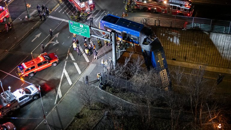Crashed through barriers: New York bus hangs down from bridge