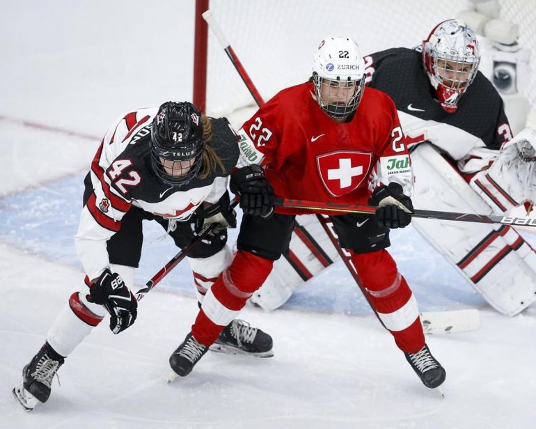 Spooner scored twice in women's hockey worlds for Canada in a 5–0 win over Switzerland.