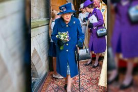 Queen Elizabeth walks on a stick - also honored with a walker - royals