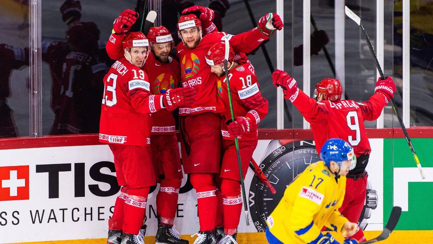 Belarusians celebrate after the only goal of the game against Sweden.