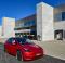 A Tesla Model Y stands in front of the Tesla Gigafactory in Grunheide/Brandenburg for open day