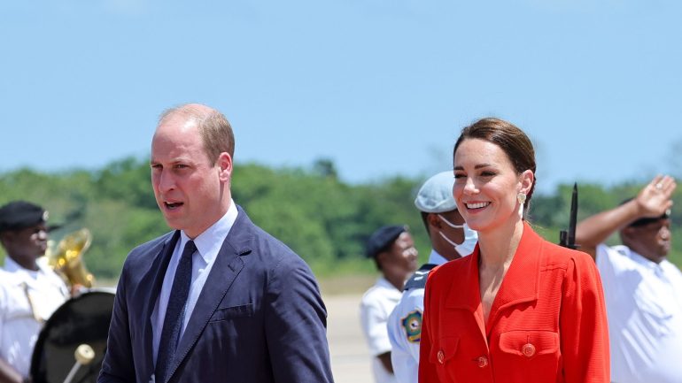 sweet moment!  Prince William holds Kate's hand