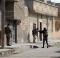 Kurdish security forces patrol in Syria's Hassaq after an attack on a prison by IS