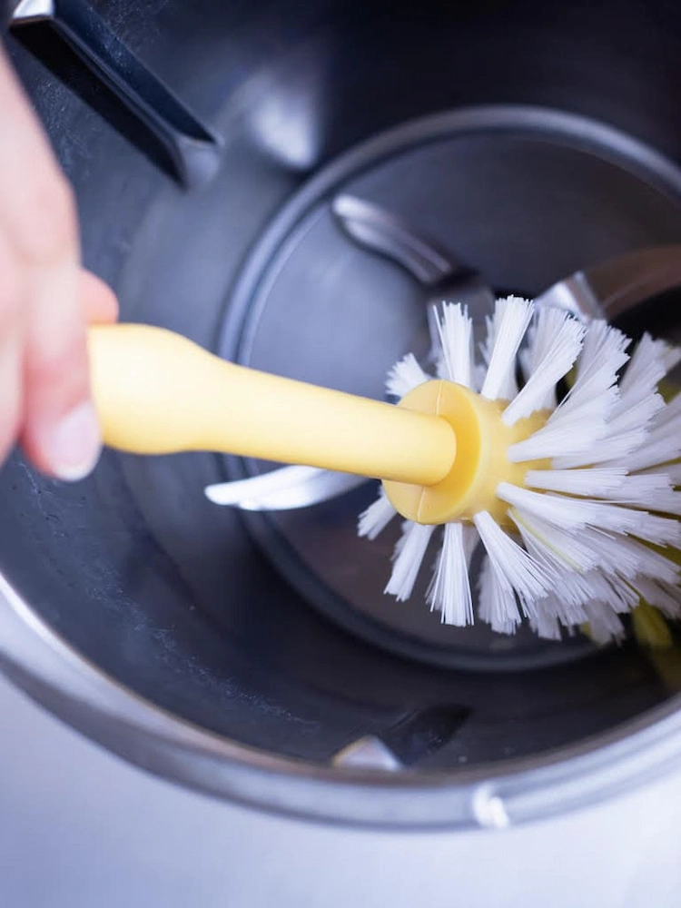 Use a soft-bristled bottle brush and clean the bowl of the Thermomix cooker.