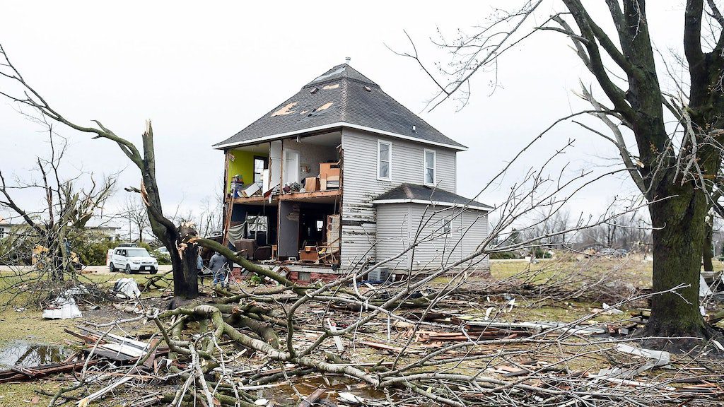 The facade of a house is missing in Taupe, Minnesota, after a tornado.  The US Weather Service has warned of severe storms in Central America with heavy snowfall and strong thunderstorms.