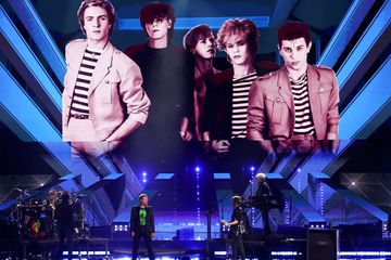 Duran Duran stood upon his joining "Rock and Roll Hall of Fame" Without Andy Taylor on stage.  He can be seen in an old picture in the background.